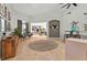 Open-concept living room featuring tile flooring, neutral walls, stylish furniture, and bright views at 6542 Lake Pembroke Pl, Orlando, FL 32829