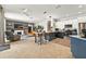 Open floor plan with the kitchen island with barstool seating looking into the living room at 6542 Lake Pembroke Pl, Orlando, FL 32829