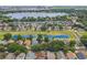 Expansive aerial view of neighborhood homes with lake view and surrounding landscape at 6702 Imperial Oak Ln, Orlando, FL 32819