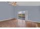 Bedroom with tile flooring, ceiling fan, and a sliding glass door leading to the pool at 6702 Imperial Oak Ln, Orlando, FL 32819