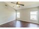 Empty bedroom with hardwood floors, neutral walls, a window, and a ceiling fan at 6702 Imperial Oak Ln, Orlando, FL 32819