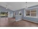 Spacious living room with neutral walls, tile flooring, and ample natural light from the windows at 6702 Imperial Oak Ln, Orlando, FL 32819