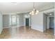 Spacious living room with tile flooring, high ceilings and a chandelier at 6702 Imperial Oak Ln, Orlando, FL 32819