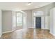 Bright living room with tile flooring, vaulted ceilings, and large windows at 6702 Imperial Oak Ln, Orlando, FL 32819