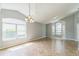 Spacious living room with tile flooring, large windows, and plenty of natural light at 6702 Imperial Oak Ln, Orlando, FL 32819