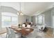 Open-concept living and dining area filled with natural light and contemporary furnishings at 6702 Imperial Oak Ln, Orlando, FL 32819