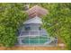 Aerial view of private pool with a screened enclosure at 6702 Imperial Oak Ln, Orlando, FL 32819