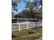 Charming home featuring a well-maintained front yard and classic white picket fence at 732 Trenton Rd, Lakeland, FL 33815