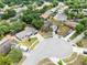 Aerial view of a residential neighborhood with tree-lined streets and cul-de-sacs at 7741 Pine Hollow Ct, Orlando, FL 32822