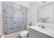 Bright bathroom featuring tiled shower/bath and vanity with lots of counter space at 7741 Pine Hollow Ct, Orlando, FL 32822