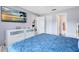 Bright bedroom with modern TV, large dresser, and walk-in closet at 7741 Pine Hollow Ct, Orlando, FL 32822