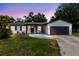 Charming single Gathering home with attached garage, walkway and lush landscaping at 7741 Pine Hollow Ct, Orlando, FL 32822