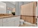 Bathroom with vanity featuring granite countertops and a shower-tub combo at 8150 Prestbury Dr, Orlando, FL 32832