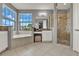 Bright bathroom with a soaking tub, walk-in shower, and dual sink vanity, offering a spa-like experience at 8150 Prestbury Dr, Orlando, FL 32832