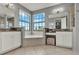 Bright bathroom with a garden tub, double sink vanity, granite countertops, and large windows providing lots of natural light at 8150 Prestbury Dr, Orlando, FL 32832