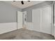 Bedroom featuring carpet, a ceiling fan, closet with sliding doors, and beadboard trim at 8150 Prestbury Dr, Orlando, FL 32832