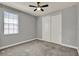 Neutral bedroom featuring gray carpet, ceiling fan and a window with wood blinds at 8150 Prestbury Dr, Orlando, FL 32832