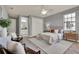 Bedroom featuring a queen bed, neutral decor, a sitting area, with ensuite bath and walk-in closet at 8150 Prestbury Dr, Orlando, FL 32832