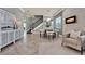 Elegant dining room featuring tile floors, modern fireplace, and sophisticated decor creating a welcoming atmosphere at 8150 Prestbury Dr, Orlando, FL 32832