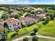 Beautiful two-story homes feature tile roofs, lush landscaping, and fenced yards in a well-maintained community at 8150 Prestbury Dr, Orlando, FL 32832