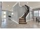 Elegant foyer features tile floors, a staircase, and an inviting space at 8150 Prestbury Dr, Orlando, FL 32832