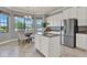 Kitchen island with stainless steel appliances, and dining table at 8150 Prestbury Dr, Orlando, FL 32832
