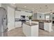 Bright kitchen featuring white cabinets, granite countertops, stainless steel appliances, and a center island at 8150 Prestbury Dr, Orlando, FL 32832