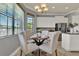 Eat-in kitchen featuring a cozy breakfast nook area and natural light at 8150 Prestbury Dr, Orlando, FL 32832