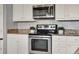 Modern kitchen with stainless steel appliances and granite countertops at 8150 Prestbury Dr, Orlando, FL 32832