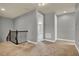 Spacious upstairs landing with carpet flooring and an open view to a bedroom at 8150 Prestbury Dr, Orlando, FL 32832
