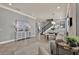 Open-concept living and dining area with tile flooring, neutral tones, and elegant decor at 8150 Prestbury Dr, Orlando, FL 32832