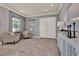 Inviting living room features neutral decor, natural light, and tile floors at 8150 Prestbury Dr, Orlando, FL 32832