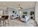Cozy living room featuring neutral decor, comfortable seating, and an abundance of natural light at 8150 Prestbury Dr, Orlando, FL 32832