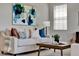 Living room showcasing a cozy sofa, coffee table, and stylish decorative art at 8150 Prestbury Dr, Orlando, FL 32832