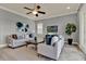 Comfortable living room featuring neutral furniture, ceiling fan, and elegant decor at 8150 Prestbury Dr, Orlando, FL 32832