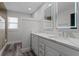 Bathroom featuring an updated vanity, a lighted mirror and a walk-in shower at 831 Islander Ave, Orlando, FL 32825