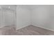 Clean bedroom featuring wood floors, neutral tones, closet, and ample natural light at 831 Islander Ave, Orlando, FL 32825