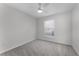 Bedroom featuring neutral walls, carpet floors, a ceiling fan, and a large window at 831 Islander Ave, Orlando, FL 32825