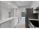 Modern eat-in kitchen features marble countertops and stainless steel appliances at 831 Islander Ave, Orlando, FL 32825