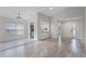 Spacious living room boasts new floors, natural light, and seamless flow to the kitchen at 831 Islander Ave, Orlando, FL 32825