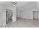 Spacious living room with light gray walls, a ceiling fan, and modern lighting at 831 Islander Ave, Orlando, FL 32825