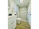 Updated bathroom with a tiled walk-in shower, modern fixtures, and a vanity with storage at 934 Savannah Ave, Lakeland, FL 33815