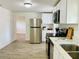 Open kitchen layout featuring stainless steel appliances, and ample countertop space at 934 Savannah Ave, Lakeland, FL 33815