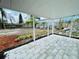 Backyard covered patio with pavers, ideal for outdoor living and entertaining, with garden at 934 Savannah Ave, Lakeland, FL 33815