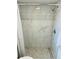 Walk-in shower with tiled walls, herringbone floor, and chrome fixtures for a modern feel at 934 Savannah Ave, Lakeland, FL 33815