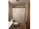 Clean and functional bathroom with shower-tub combination and neutral finishes at 5964 Peregrine Ave # C02, Orlando, FL 32819