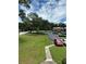 Exterior shot showcasing the complex's well-maintained landscaping and ample parking at 5964 Peregrine Ave # C02, Orlando, FL 32819