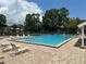 Outdoor pool and lounge area provide residents with a relaxing space to unwind at 5964 Peregrine Ave # C02, Orlando, FL 32819