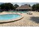 Outdoor pool and spa area provide residents with a relaxing space to unwind at 5964 Peregrine Ave # C02, Orlando, FL 32819