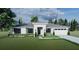 New construction home with a gray roof, white exterior, and a well-maintained lawn at 0 Overton St, Orlando, FL 32833